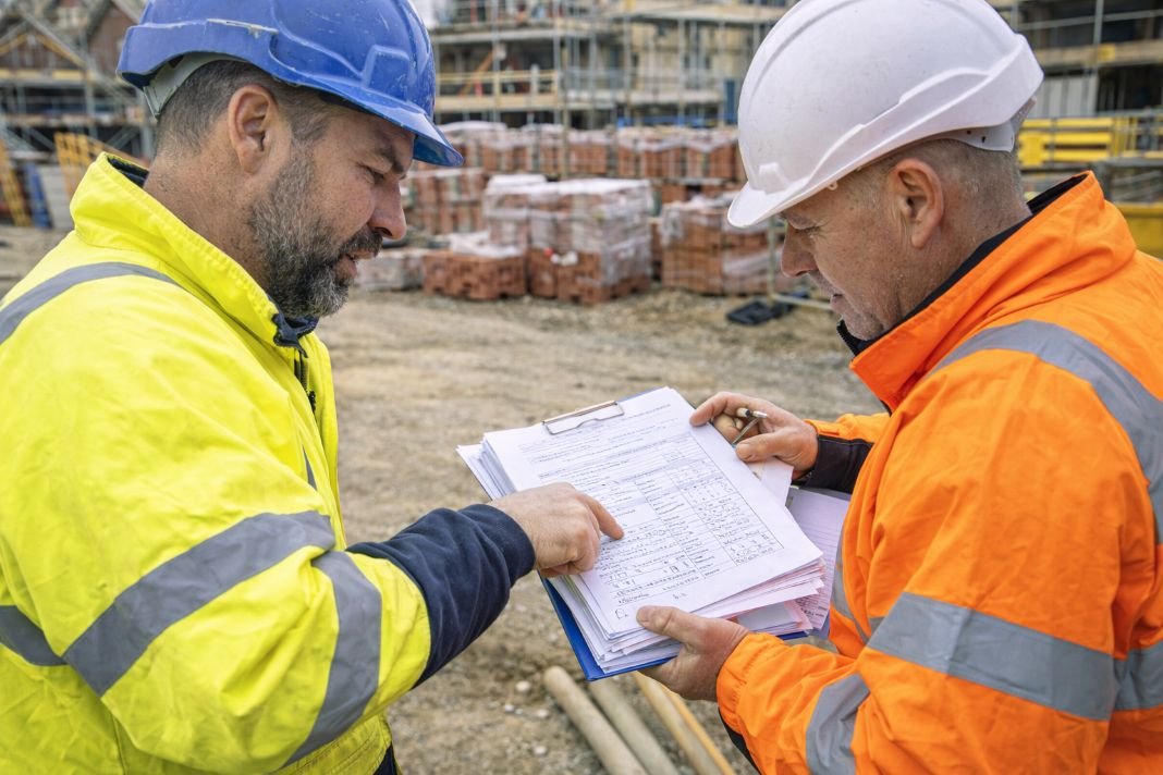 AI photo of construction workers reviewing site documents